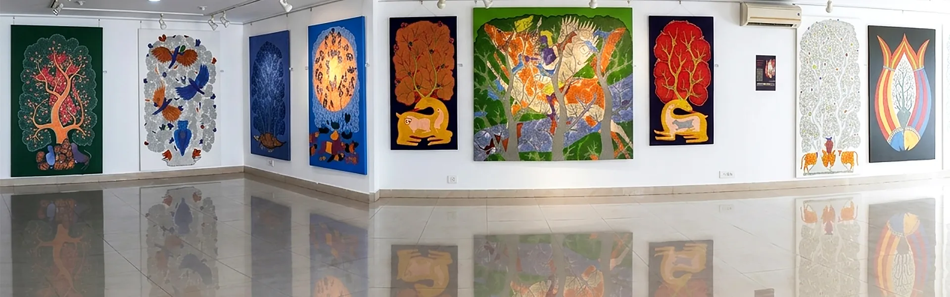 Contemporary Indian paintings displayed in the exhibition gallery at Aakriti Art Gallery