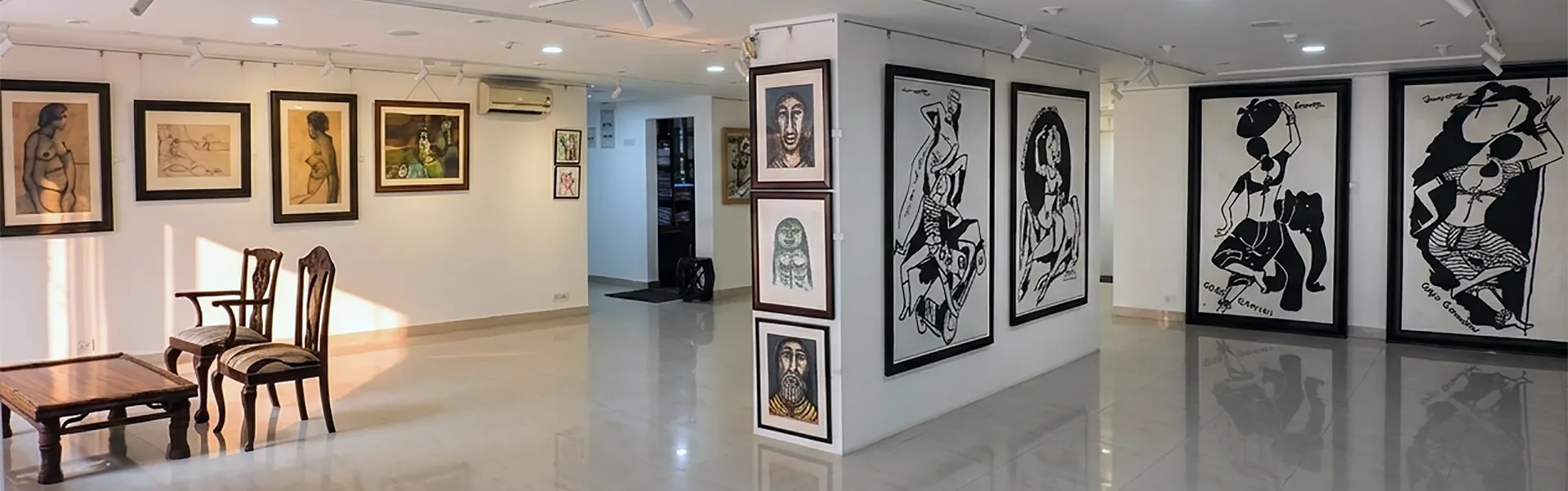 Collection of contemporary Indian paintings and drawings displayed at Aakriti Art Gallery