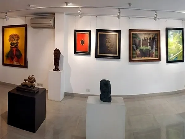 Art gallery interior showcasing original paintings and sculptures at Aakriti Art Gallery