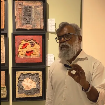 Curator & Art Historian Johny ML at the Exhibition THE SOFT STONE